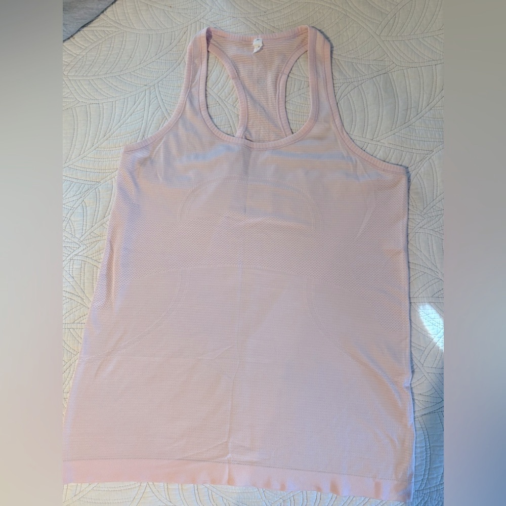 Lululemon light Pink Swiftly Racerback Tank Top. Hip length